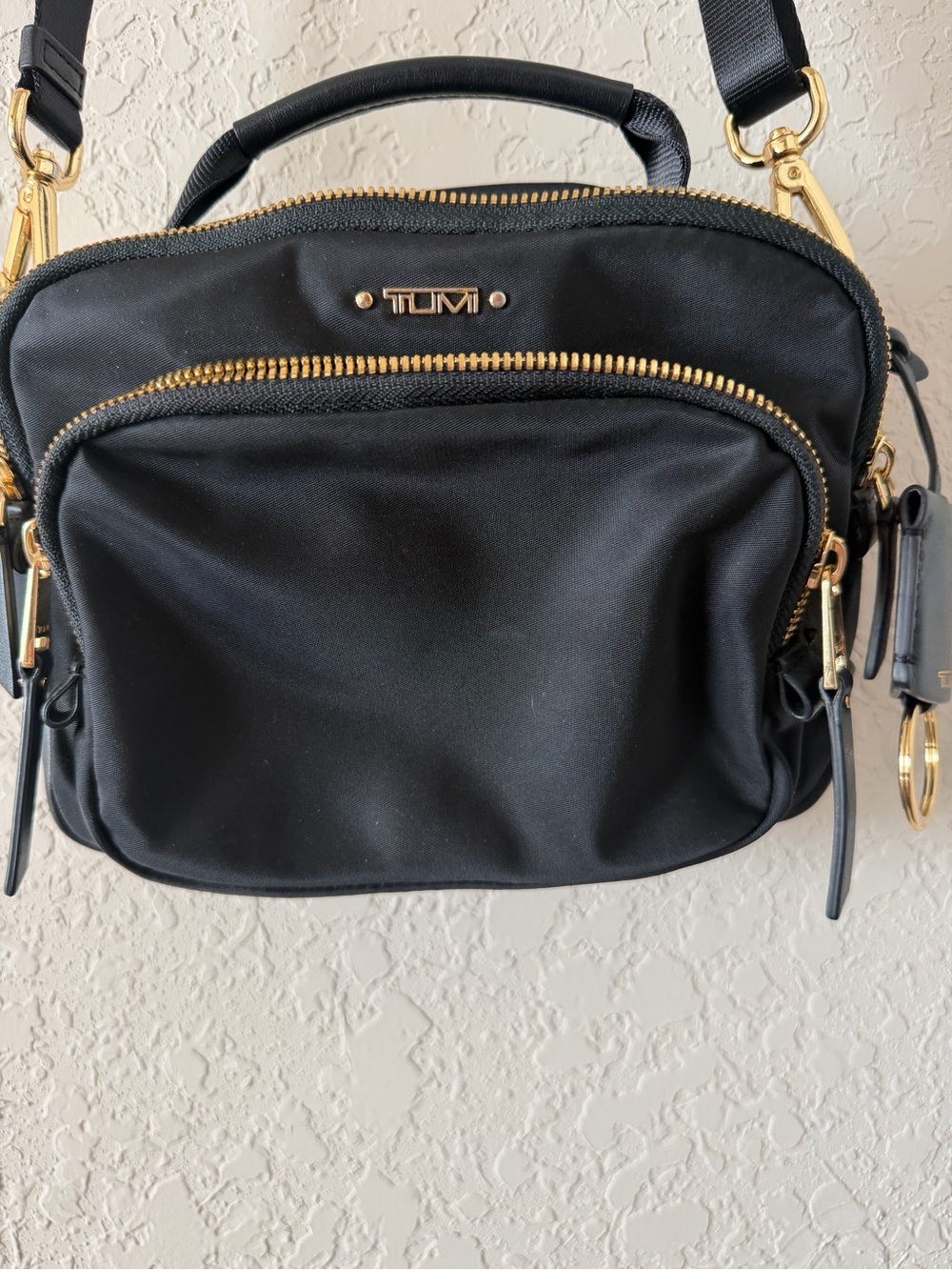 Tumi Black Crossbody Bag with Gold Hardware